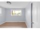 Comfortable bedroom featuring hardwood floors, a window providing natural light, and neutral wall colors at 5099 S Linden Dr, Englewood, CO 80110