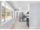 Modern kitchen with stainless steel appliances and ample natural light at 5099 S Linden Dr, Englewood, CO 80110