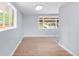 Sunlit room featuring hardwood floors and large windows at 5099 S Linden Dr, Englewood, CO 80110