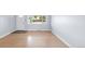 Bright living room featuring hardwood floors and a large window for natural light at 5099 S Linden Dr, Englewood, CO 80110