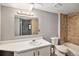Standard bathroom features a combined shower and tub with a toilet and sink at 16720 E Layton Ave, Aurora, CO 80015