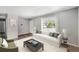 Bright living room featuring a large window, stylish furnishings and modern decor at 16720 E Layton Ave, Aurora, CO 80015