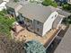 Aerial view of the house featuring a deck, backyard, and well-maintained landscaping, nestled in a quiet neighborhood at 6808 Silverleaf Ave, Firestone, CO 80504