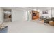 Spacious basement living area features soft carpet, built-in shelves, and a comfortable grey sofa at 6808 Silverleaf Ave, Firestone, CO 80504