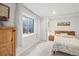 Serene bedroom with light-filled window and unique decor gives a relaxing, cozy feeling at 6808 Silverleaf Ave, Firestone, CO 80504