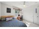 Bright bedroom with a ceiling fan, light colored carpet, a workspace, and a closet providing ample storage at 6808 Silverleaf Ave, Firestone, CO 80504