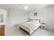 Bedroom with light walls, closet, and stylish décor; featuring a modern bed frame with a light throw at 6808 Silverleaf Ave, Firestone, CO 80504
