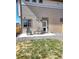 Cozy backyard with patio, chairs and green grass and rock landscaping at 10052 Zeno St, Commerce City, CO 80022