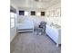 Bright Bedroom with crib, glider chair and ottoman, changing table, and neutral decor at 10052 Zeno St, Commerce City, CO 80022