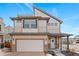 Charming two-story home featuring a front-facing garage, a welcoming porch, and modern architectural details at 10052 Zeno St, Commerce City, CO 80022