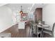 Bright open space from the kitchen to the living area with fireplace and dining nook at 10052 Zeno St, Commerce City, CO 80022