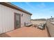 Charming rooftop patio featuring stylish outdoor seating, brick flooring, and views of the surrounding neighborhood at 10052 Zeno St, Commerce City, CO 80022