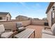 Private outdoor patio featuring comfortable seating, brick flooring, and a fenced perimeter for relaxed outdoor living at 10052 Zeno St, Commerce City, CO 80022