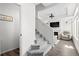 Carpeted staircase leading to the living area, showcasing the home's layout and design at 10052 Zeno St, Commerce City, CO 80022