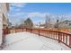 Spacious wooden deck with red railings, perfect for outdoor entertaining and relaxing at 9676 Whitecliff Pl, Highlands Ranch, CO 80129