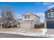 Two-story home with a two-car garage and well-maintained front yard at 9676 Whitecliff Pl, Highlands Ranch, CO 80129