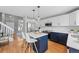 Renovated kitchen features white subway tiles, pendant lighting, and modern appliances at 9676 Whitecliff Pl, Highlands Ranch, CO 80129