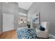 Bright living room with vaulted ceiling, decorative rug, front door and large windows at 9676 Whitecliff Pl, Highlands Ranch, CO 80129