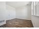 Bright and airy bedroom with wood-look floors and ample natural light at 6870 Merseyside Ln, Castle Pines, CO 80108