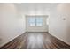 Bright dining room with hardwood floors and large windows at 6870 Merseyside Ln, Castle Pines, CO 80108