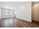 Bright dining room with hardwood floors and large windows at 6870 Merseyside Ln, Castle Pines, CO 80108