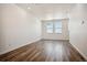 Bright dining room with hardwood floors and large windows at 6870 Merseyside Ln, Castle Pines, CO 80108