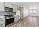 Well-equipped kitchen featuring stainless steel appliances, a tiled backsplash, and ample counter space at 6870 Merseyside Ln, Castle Pines, CO 80108