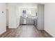 Modern kitchen featuring gray cabinets, stainless steel appliances, and wood-look floors at 6870 Merseyside Ln, Castle Pines, CO 80108