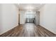 Open living room with hardwood floors and kitchen view at 6870 Merseyside Ln, Castle Pines, CO 80108