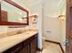 Half bath featuring a vanity with stone countertop and decorative lighting at 4600 S University Blvd, Englewood, CO 80113
