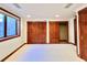 Carpeted bedroom with natural light and wood trim at 4600 S University Blvd, Englewood, CO 80113