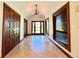 Welcoming entryway features elegant tile flooring, paneled doors, and large windows with natural light at 4600 S University Blvd, Englewood, CO 80113