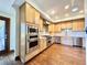 Well-equipped kitchen with stainless steel appliances, ample cabinet space, and hardwood floors at 4600 S University Blvd, Englewood, CO 80113