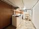 Functional laundry room with washer, dryer, sink, and storage shelf at 4600 S University Blvd, Englewood, CO 80113