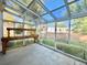 Glass enclosed sunroom providing natural light and outdoor view at 4600 S University Blvd, Englewood, CO 80113