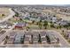 Neighborhood aerial showcasing the community layout with well-maintained lawns, roads, and coordinated home designs at 9694 Dunning Cir, Highlands Ranch, CO 80126