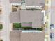 A direct aerial shot over rooftops revealing neat yard features, showing the layout of houses and properties at 9694 Dunning Cir, Highlands Ranch, CO 80126