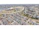 Wide aerial image of a sprawling community, nestled in a landscape with paths and recreational areas at 9694 Dunning Cir, Highlands Ranch, CO 80126