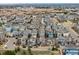 A high-angle aerial view shows many homes of similar design, densely arranged in a neighborhood layout at 9694 Dunning Cir, Highlands Ranch, CO 80126