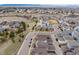 High aerial perspective of community with roads and terrain, highlighting the neighborhood’s proximity to amenities at 9694 Dunning Cir, Highlands Ranch, CO 80126
