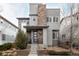 Beautiful two-story home with stone accents and a well-manicured front yard at 9694 Dunning Cir, Highlands Ranch, CO 80126