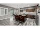Well-lit kitchen features a large island with seating and stainless steel appliances at 9694 Dunning Cir, Highlands Ranch, CO 80126