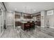 Gorgeous kitchen with stainless steel appliances and a large island with bar stools at 9694 Dunning Cir, Highlands Ranch, CO 80126