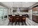 Bright and modern kitchen with a large island, stainless appliances, and stylish barstools at 9694 Dunning Cir, Highlands Ranch, CO 80126