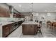 Well-equipped kitchen with granite counters, modern appliances, and ample cabinet space at 9694 Dunning Cir, Highlands Ranch, CO 80126