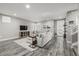 Bright living room with stylish decor, hardwood floors, and large windows at 9694 Dunning Cir, Highlands Ranch, CO 80126