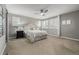 Spacious main bedroom with neutral tones, plantation shutters, and a ceiling fan at 9694 Dunning Cir, Highlands Ranch, CO 80126