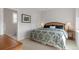Relaxing bedroom with a plush bed, neutral decor, and ensuite bathroom entrance at 4781 Saddle Iron Rd, Castle Rock, CO 80104