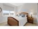 Bright bedroom with a large window, neutral decor, and modern furnishings at 4781 Saddle Iron Rd, Castle Rock, CO 80104
