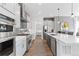 Gourmet kitchen boasting stainless steel appliances, ample counter space, and an open layout perfect for culinary enthusiasts at 4781 Saddle Iron Rd, Castle Rock, CO 80104